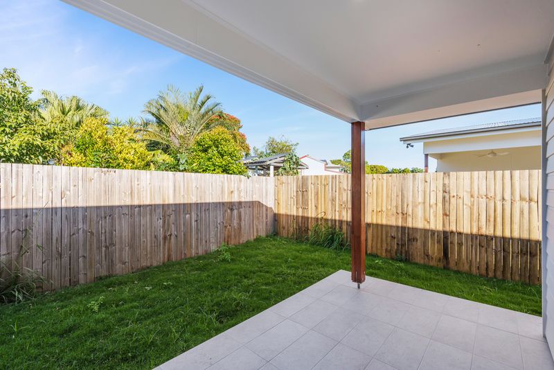 Covered alfresco area and fenced back yard