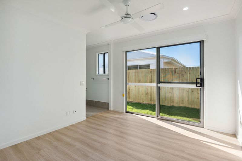Resident bedroom with sliding door to the yard