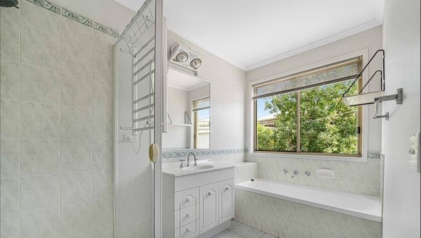 Bathroom with bath, shower and vanity