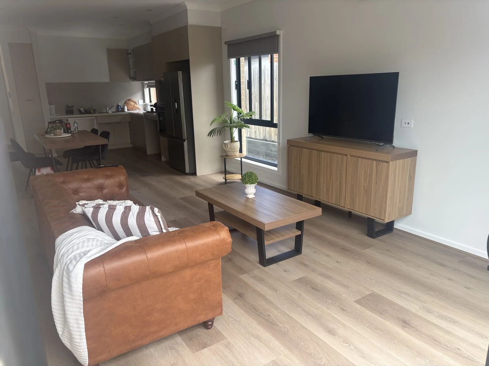 Living area with a sofa and television