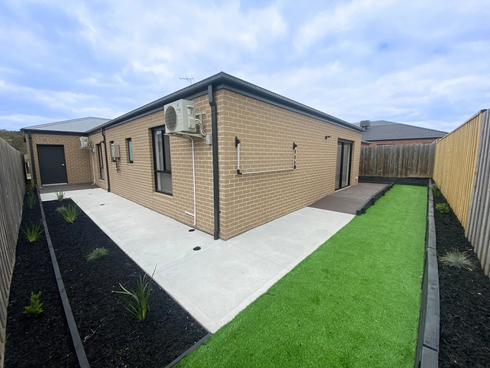 Enclosed back garden with lawn