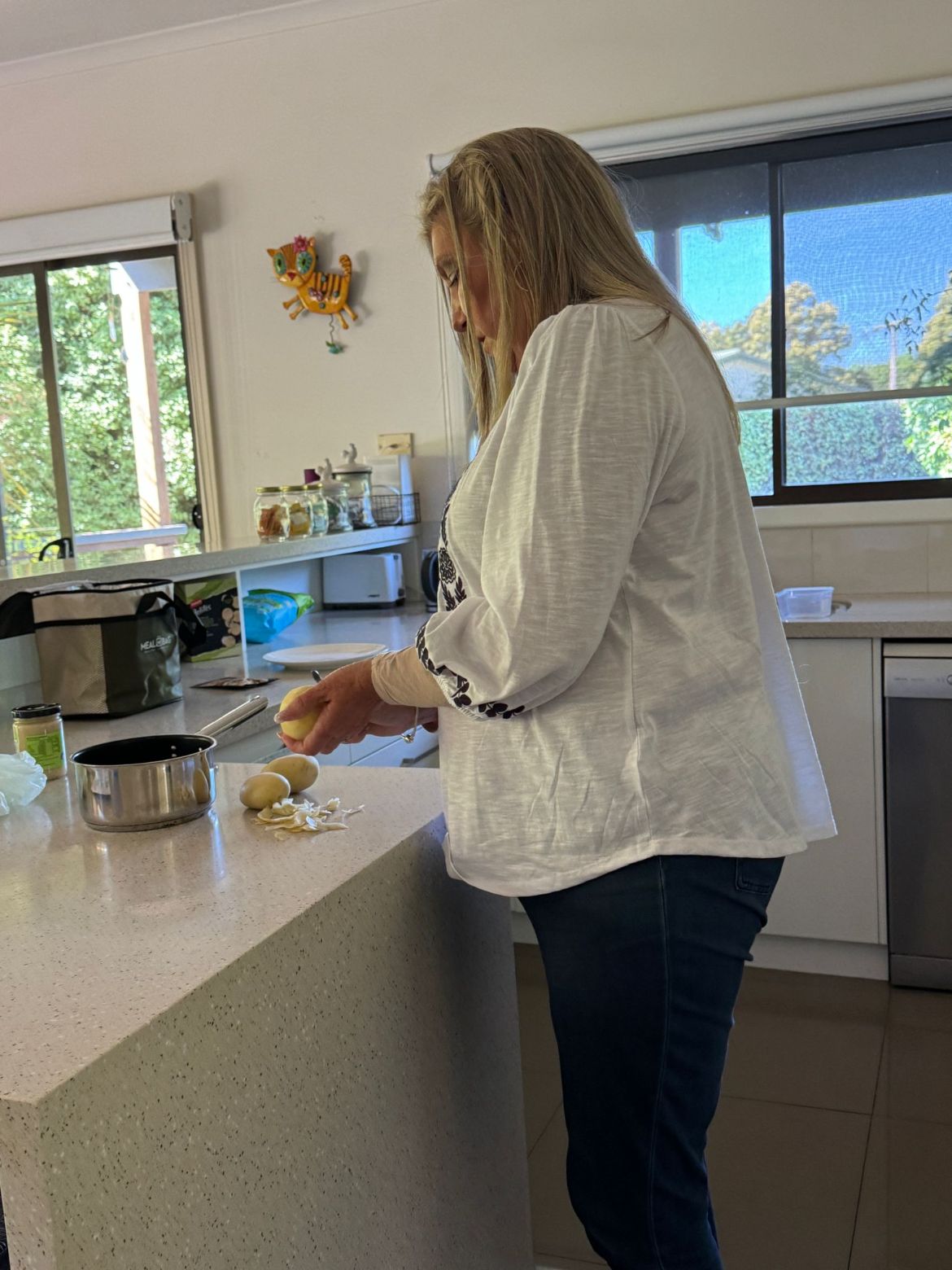 Cooking a meal at home with support nearby