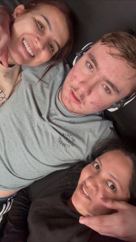 A participant at home with two of his support workers